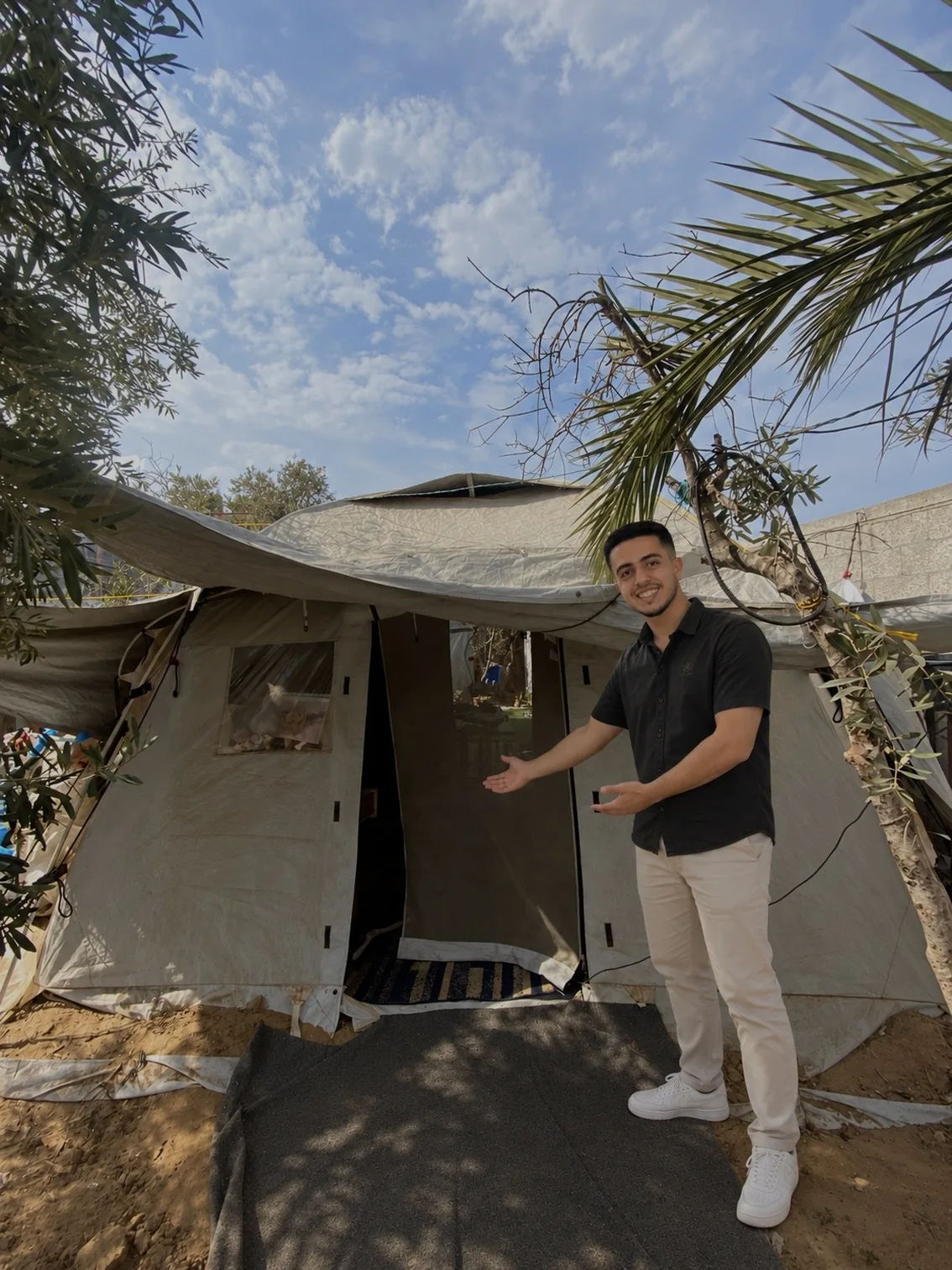 The ONE SOUL tent in Gaza, under an olive tree, with Mohammed welcoming you at its door, ready to open